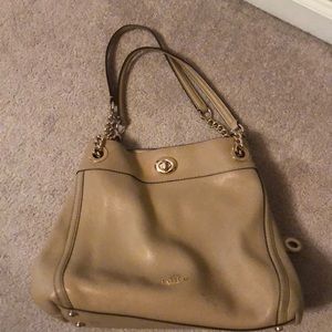 Tan coach handbag in good condition.